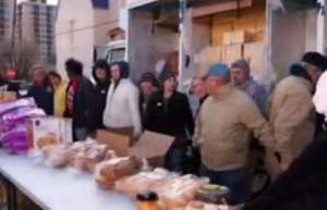 volunteers prepare to distribute food to hungry